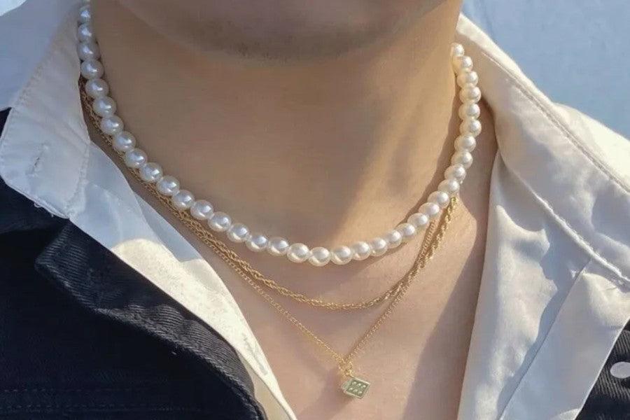 collier perle homme signification